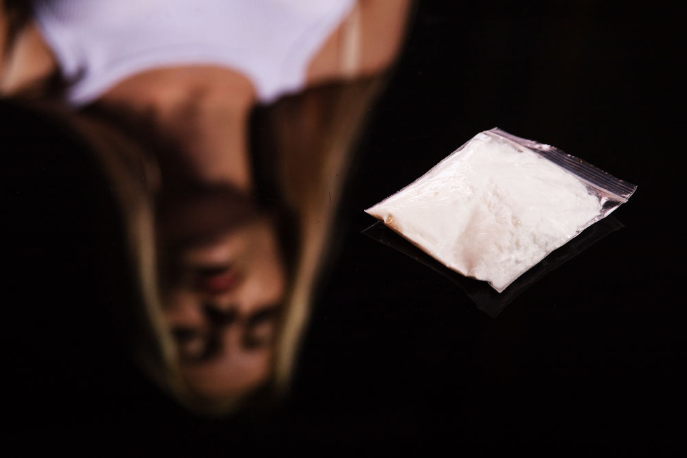 Why are women more likely to get hooked on cocaine?
